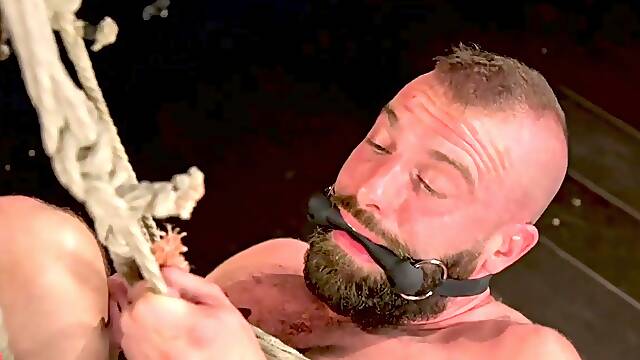 Colby Jansen and Donnie Argento Intense Leather Dungeon Rope Suspension Blowjob