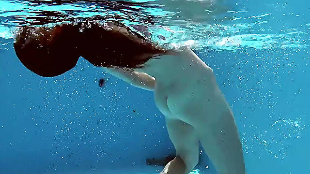 Hot mixed race teen swims naked in pool