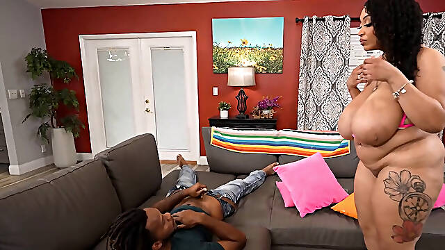 Ebony BBW shakes her big tits and ass riding a black cock